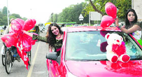 Girls wave balloons in Sector 10, Chandigarh, on Thursday.