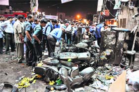 Looking for clues: The police and investigators at the scene of a bomb blast at Dilsuknagar in Hyderabad on Friday