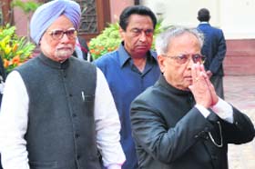 PM Manmohan Singh with President Pranab Mukherjee at Parliament in New Delhi on Thursday