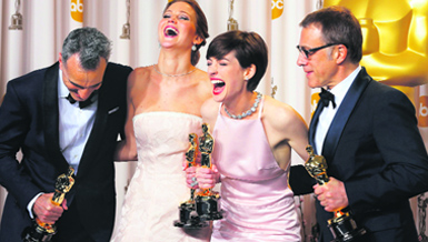 (From left) Best Actor winner Daniel Day Lewis, Best Actress winner Jennifer Lawrence, Best Supporting Actress winner Anne Hathaway and Best Supporting Actor winner Christoph Walz pose with their Oscars backstage at the 85th Academy Awards in Hollywood on Sunday.  Reuters