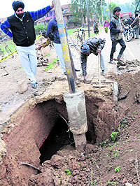 A stormwater line caves in at Sector 51, Chandigarh, on Wednesday