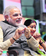  Gujarat CM Narendra Modi with party leader Sushma Swaraj at the BJP conclave in New Delhi on Sunday.