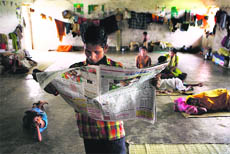 Villagers displaced by the construction of a steel plant by South Korean steelmaker Posco rest at a shelter for displaced persons in Jagatsinghpur district in this file photo. 