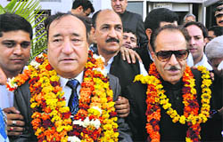 Muzaffar Parrey, MLC Congress, (L) along with Saif-ud-din Soz, PCC chief, after winning the election in Jammu on Thursday.