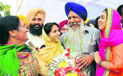 Gulzar Singh Ranike (in blue turban) with his family after taking oath on Thursday.