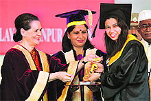 Sonia Gandhi honours a student of Bakth Phul Singh Women University in Sonepat on Friday