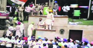 Congress legislators stand on tables in the Vidhan Sabha