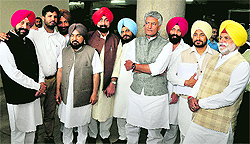 Punjab Cong MLAs after their suspension from the Vidhan Sabha session with Leader of Opposition Sunil Jakhar in Chandigarh on Thursday