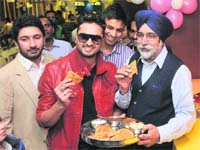 Tasting time: Roshan Prince (in red) and Sikander Singh Malooka at Only Parathas. Photo: Pradeep Tewari