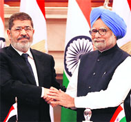Prime Minister Manmohan Singh with Egyptian President Mohamed Morsi in New Delhi on Tuesday. 