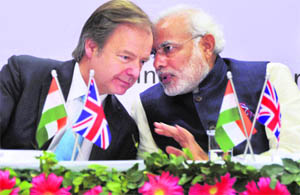 Gujarat CM Narendra Modi with British Minister of State for Foreign Office Hugo Swire in Gandhinagar. 