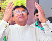 Former Pakistani President Pervez Musharraf gestures upon his arrival at Karachi airport on Sunday. 