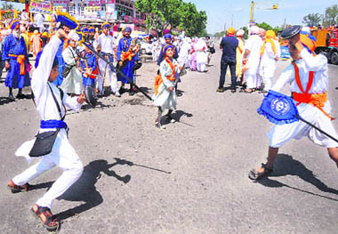 Boys perform gatka during a holy procession near Keshgarh Sahib Gurdwara at Anandpur Sahib on Tuesday.