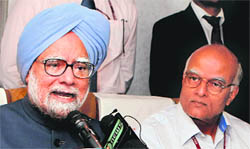 Prime Minister Manmohan Singh addresses mediapersons aboard his special aircraft on his way back to India after the BRICS Summit in Durban on Thursday.