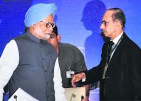 PM Manmohan Singh with CII president Adi Godrej in New Delhi on Wednesday