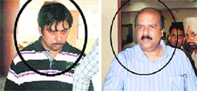 I-T Deputy Commissioner PK Bhattacharya and (right) chartered accountant Ashwini Gupta at the CBIs special court on Patiala on Wednesday