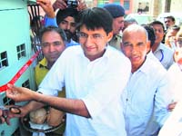 MP Deepender Singh Hooda inaugurates a new system of power supply at Chirod village in Hisar on Saturday