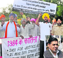 Victims of 1984 riots raise slogans against Jagdish Tytler (inset) outside Karkardooma Court in New Delhi on Wednesday. 