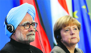 Prime Minister Manmohan Singh and German Chancellor Angela Merkel address a news conference in Berlin on Thursday.