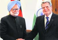 PM Manmohan Singh shakes hands with German President Joachim Gauck prior to a meeting in Berlin on Friday.  PTI