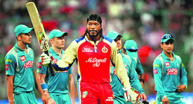 Royal Challengers Chris Gayle celebrates his century against Pune Warriors during their IPL match at Chinnaswamy Stadium in Bangalore on Tuesday