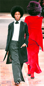 Models present creations by Japanese fashion designer Yohji Yamamoto during his show in Berlin.