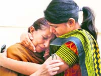 Sarabjit's daughter Swapandeep (right) consoles his sister Dalbir Kaur