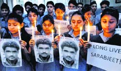 Students hold a candle light vigil in Amritsar on Monday seeking speedy recovery of Sarabjit Singh.  PTI