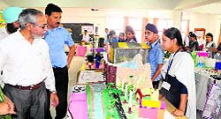 Dr Vinod Kumar Sharma, DEO Schools (left) takes a look at the models displayed during “Inspire Award Science Exhibition at Shishu Niketan School, Sector 66, in Mohali on Saturday