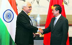 External Affairs Minister Salman Khurshid meets his Chinese counterpart Wang Yi (R) in Beijing on Thursday