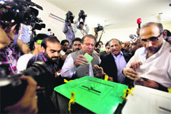 PML-N chief Nawaz Sharif casts his vote in Lahore on Saturday.  AP/PTI