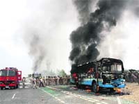 One of the four Haryana Roadways buses torched by protesters at Rohtaks Karontha village on Sunday