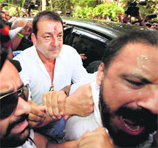 Sanjay Dutt reaches the TADA court to surrender in Mumbai on Thursday.