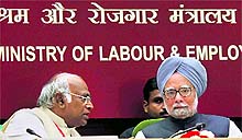 Prime Minister Manmohan Singh with Union Minister for Labour and Employment Mallikarjun Kharge during the 45th Session of the Indian Labour Conference in New Delhi on Friday