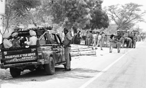 Security forces keep a vigil at Lambi on Monday. A Tribune photograph