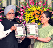 AICC chief Sonia Gandhi and PM Manmohan Singh release UPA-IIs report card in New Delhi. 