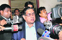 BCCI president N Srinivasan talks to the media as he leaves the BCCI headquarters in Mumbai on Wednesday.  PTI