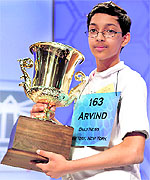 Arvind Mahankali holds the trophy after winning the National Spelling Bee in Maryland on Thursday
