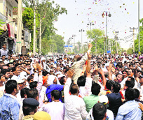Supporters of various candidates outside Jat College on Delhi road in Rohtak.