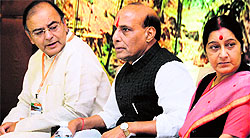 BJP chief Rajnath Singh with party leaders Arun Jaitley (L) and Sushma Swaraj at the party's conclave in Panaji on Saturday