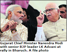  Gujarat Chief Minister Narendra Modi with senior BJP leader LK Advani at rally in Bharuch.