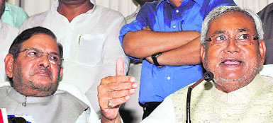 Bihar CM Nitish Kumar (R) with JD(U) national chief Sharad Yadav in Patna on Sunday. 