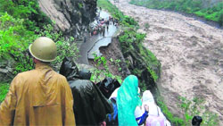 Rescue operations underway at a collapsed road in Chamoli district in Uttarakhand on Monday.  AFP 