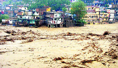 The Kedarnath Temple (C, foreground) amid flood destruction in the holy town of Kedarnath in Rudraprayag on Tuesday