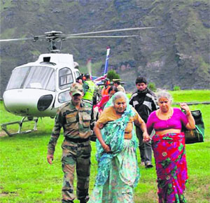 Army personnel rescue pilgrims in Hemkund Sahib area.