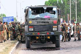A damaged Army truck at Hyderpora bypass on the Srinagar-Jammu National Highway on Monday