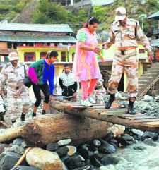 ITBP personnel rescue stranded people in the Badrinath area.