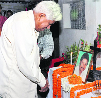 Father of Pakur SP Amarjit Balihar pays homage to his son at their Ranchi residence on Tuesday.