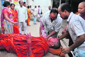 An injured monk receives medical treatment at a hospital in Gaya on Sunday
