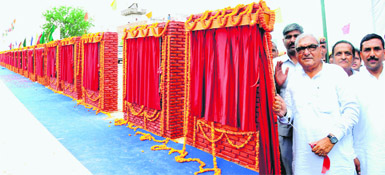 Haryana CM Bhupinder Singh Hooda laid the foundation stone of 23 projects and inaugurated four others at Bawani Khera in Bhiwani district on Saturday. On extreme right is Chief Parliamentary Secretary Ram Kishan Fauji.